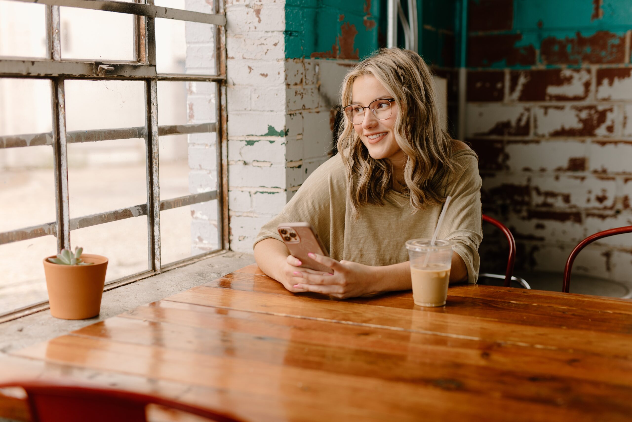 Woman in a cafe on her phone