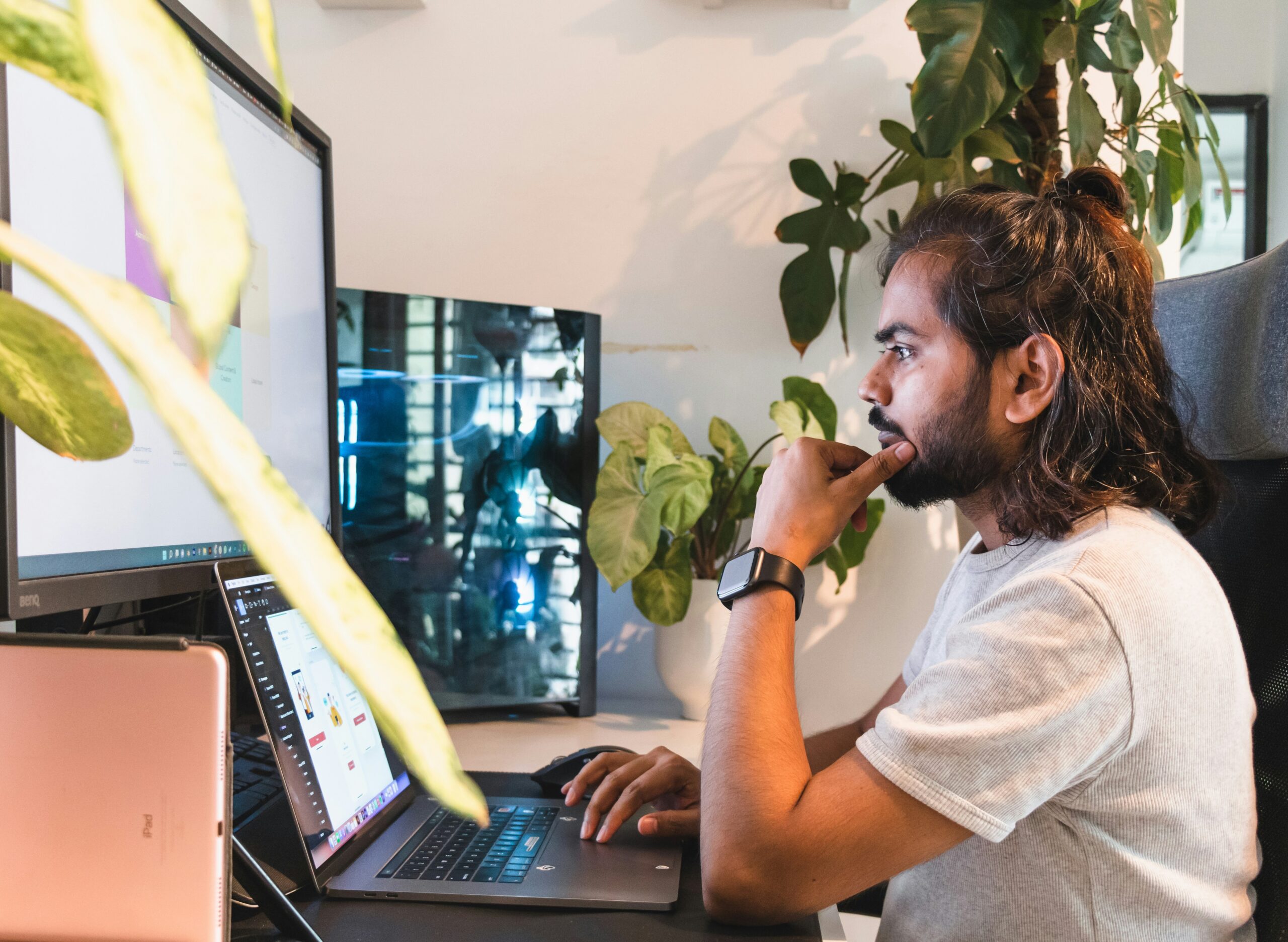 Man moderating social media on a computer