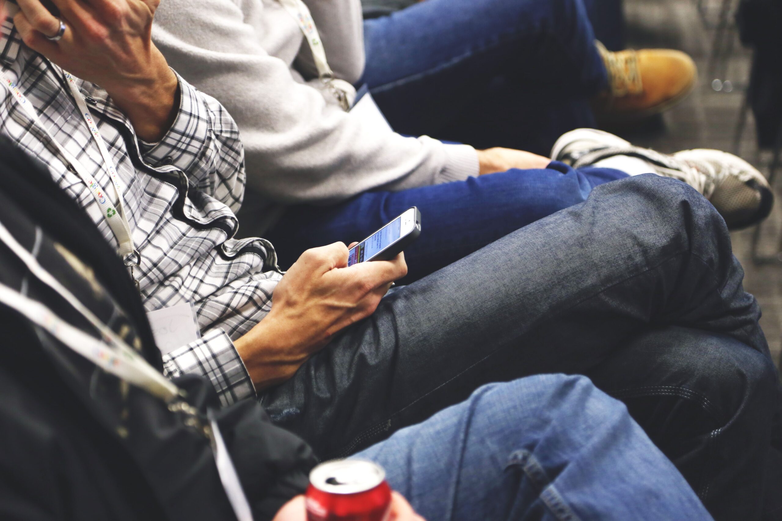 Person on their phone sitting down