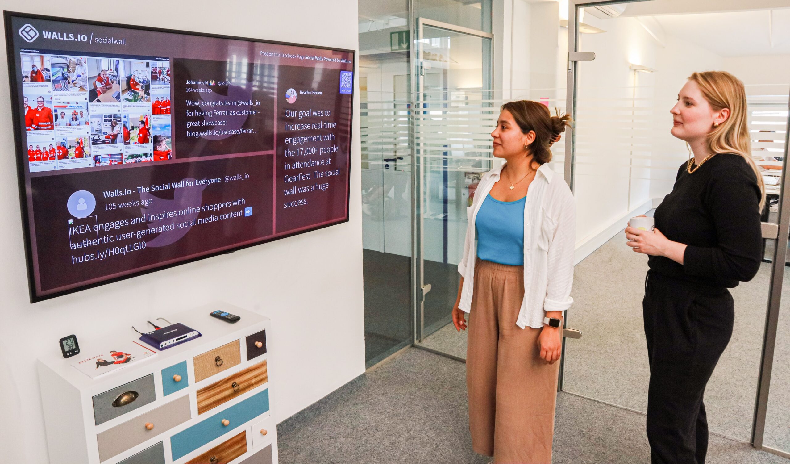 someone looking at social posts on a tv screen